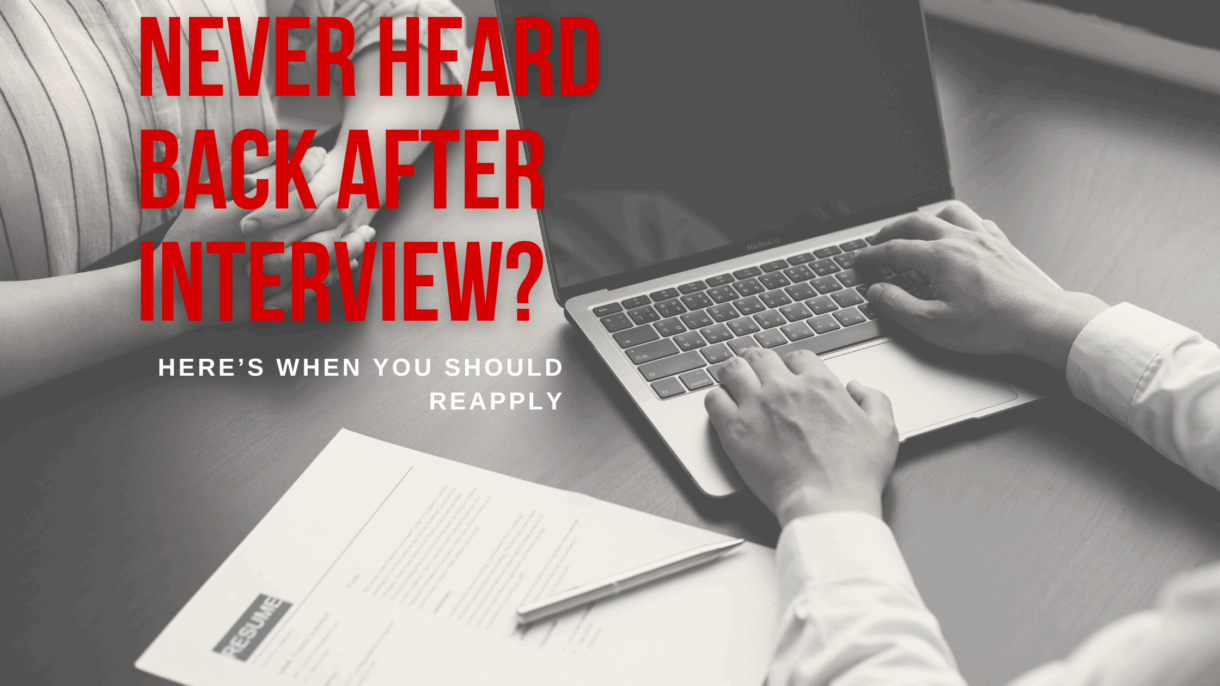 two people at a desk interviewing for a job